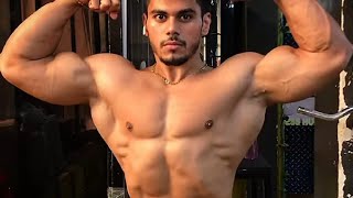 Young muscle guy flexing