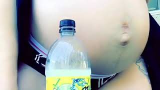 Pregnant daughter does the bottlecap challenge with baby belly