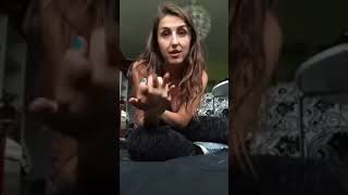 Woman takes off shoes and socks to show off feet