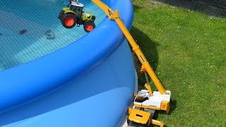 Bruder Toys Scania Liebherr crane truck Rescue the sunken tractor Claas our pool.