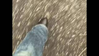 Man walking in high heel boots