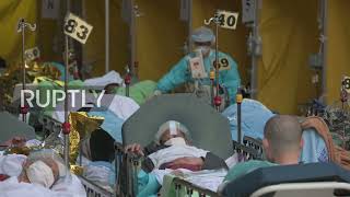 Patients treated outdoors at Caritas Medical Centre following surge in Omicron COVID-19 cases