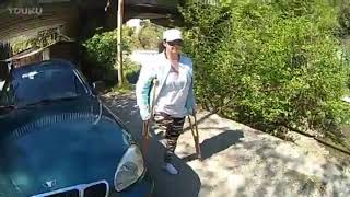 Amputee woman washing car