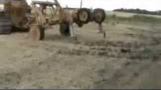 moleplough twin leg pulled by 310hp D8k  24" deep with 4" expanders