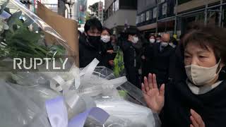 Japan: People leave flowers outside Osaka mental health clinic after blast kills 24