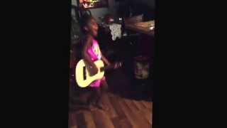 Little girl playing guitar and being silly✨