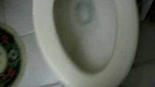 Trying to pee standing up.