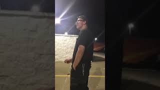 2 Dudes Throw up at a gas station parking lot.
