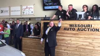 auto auctioneers: Toya McLeod and Kris Mooney