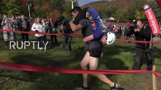Bumpy road - Couples run through 278-yard obstacle course in wife-carrying championship