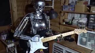 Naked female guitar robot.