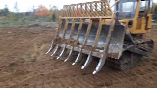 Case 1150 dozer raking