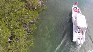 Girl flashes drone on boat