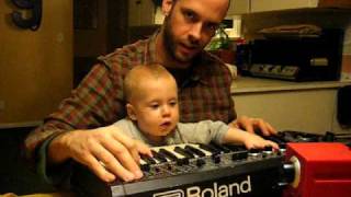 Isaac and Daddy on the Roland SH-2