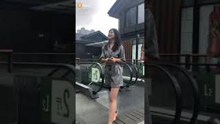Chinese amputee girl with high heel shoes walks on the prosthesis