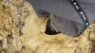 Yellow boots in deep mud (clay)