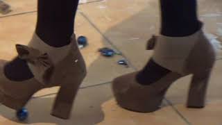 Crushing and destruction of a Christmas tree in high heels.