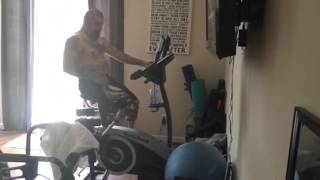 Amputee riding a stationary bike