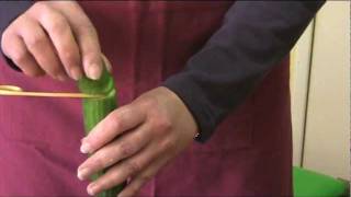 Using the spiral cutter on a cucumber