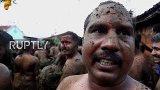 India: Holy cow dung! Villagers throw dung during 'Gore Habba' festival