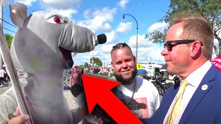 "Trump Is A RAT!": Man In Rat Suit CRASHES Live MAGA TV Interview