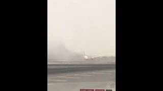 Emirates Boeing 777-300 registration A6-EMW sliding to a halt after failed go around
