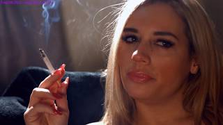 My beautiful wife chain smoking corks cigarettes while relaxing at home