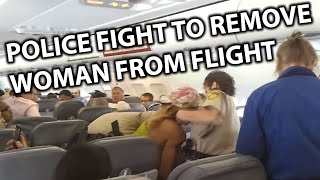 Police Fight to Remove Disruptive Woman off Spirit Airlines Flight