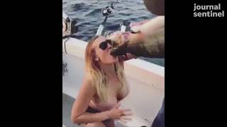 Video of woman chugging beer out of a salmon on fishing trip in Wisconsin goes viral
