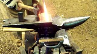 Artist Blacksmith Forging Iron Leaf