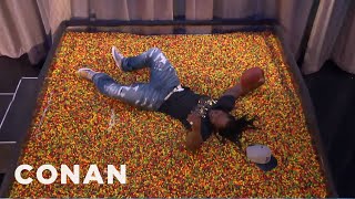 Marshawn Lynch Dives Into An End Zone Of Skittles  - CONAN on TBS