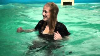 Joyce in wet clothes in pool