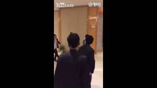 Chinese men beat a woman with a chair
