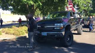 Masked Protester tries to stop truck from leaving