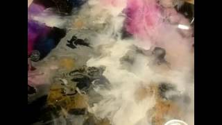 Finished epoxy artresin painting with alcohol inks and night glow