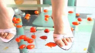 Asian girl crushes mini tomatoes part1
