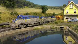 Delaware and Hudson Alcos 5009 and 503 lead the "Mill Job" past Cammerons Pond - Central Bridge N.Y.