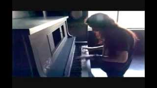 Tuomas Holopainen playing the piano.