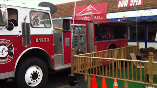Fire truck sports bar with beer on tap, tv and food on the back