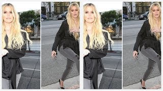 Khloe Kardashian looks stunning in skintight jeans as she heads for some spiritual healing in