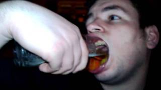 Whole pint glass in mouth