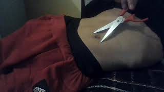 Playing with my belly button with scissors