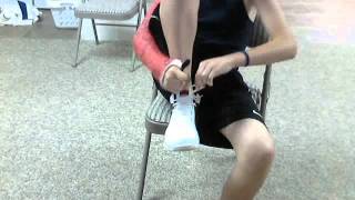 Putting socks and shoes on with a cast