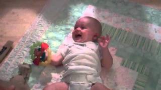 Baby laughing at ripping paper - Version Julian