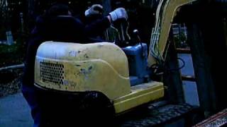the miniest of mini excavators. the man is bigger than the machine.