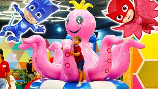 Funny baby play giant octopus. IRL Kids Indoor Playground Play Area Heroes pj masks Catboy & Owlette
