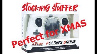 x31 toy fold up drone with controller, flips very inexpensive stocking stuffer