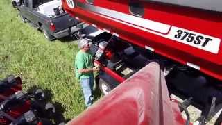 J&M Speed Tender 375 loading soybeans in a 1250 Case IH