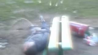 Drunk russian takes a piss  while laying on the ground