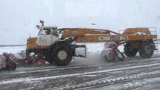 Old soviet snowfighter DE-224 on 2x2 MoAZ-546P tractor